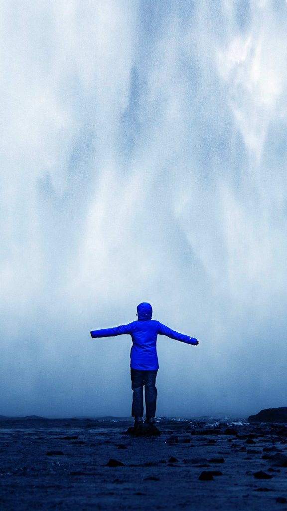 man in front of waterfall-1080x1920